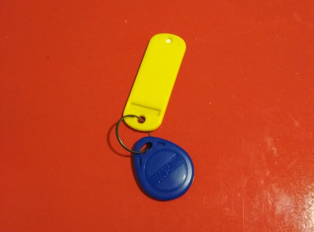 My apartment key (blue) and keychain (yellow)